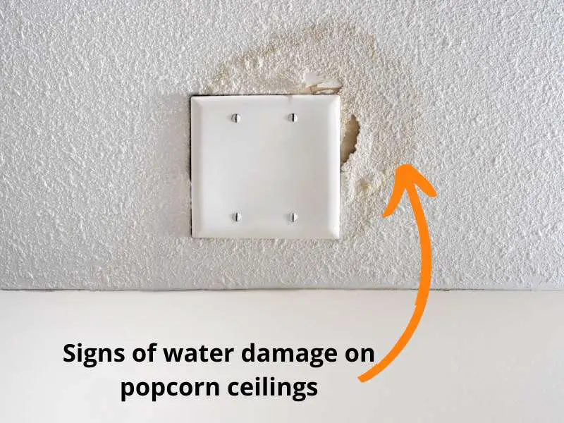 Signs of water damage on popcorn ceiling.